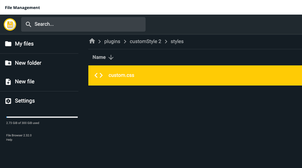 File management interface showing a directory path with a highlighted "custom.css" file in yellow. Options for new file, new folder, and settings are on the left sidebar.